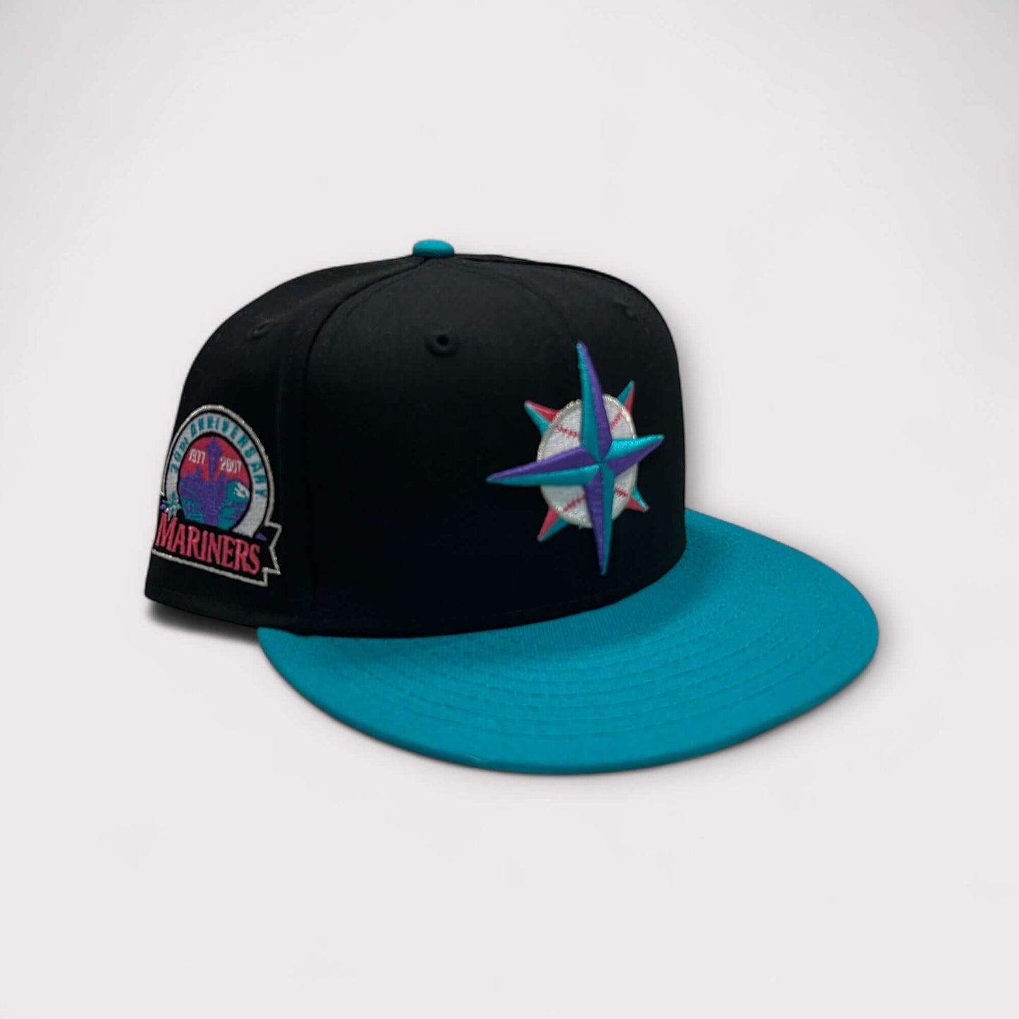 Fitted hat featuring Seattle Mariners logo and a teal brim, perfect for baseball fans.