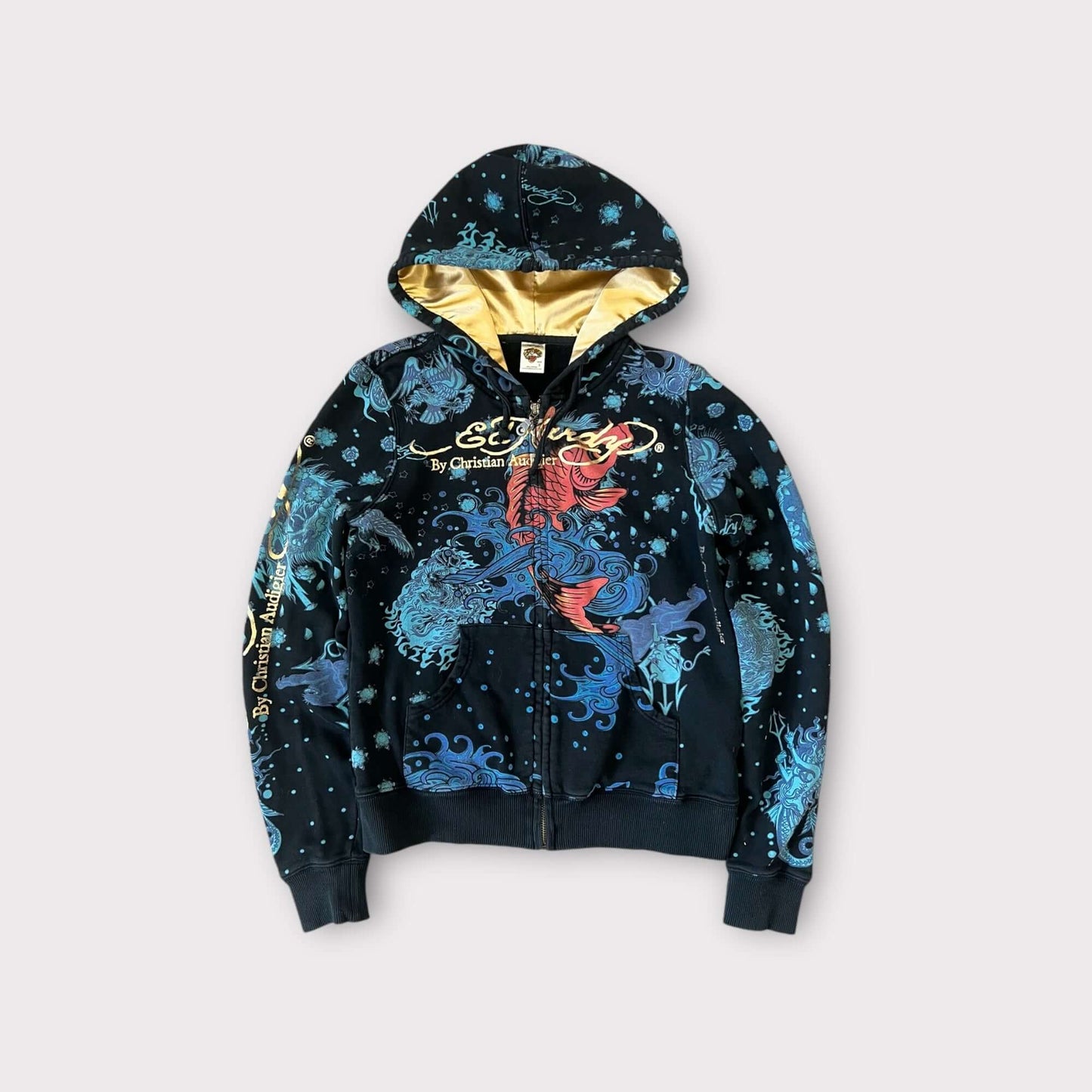 Ed Hardy hoodie featuring colorful graphic designs and a gold interior, perfect for stylish casual wear.